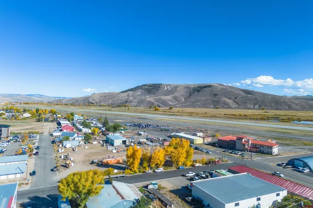 a view of a terrace with a table and chairs