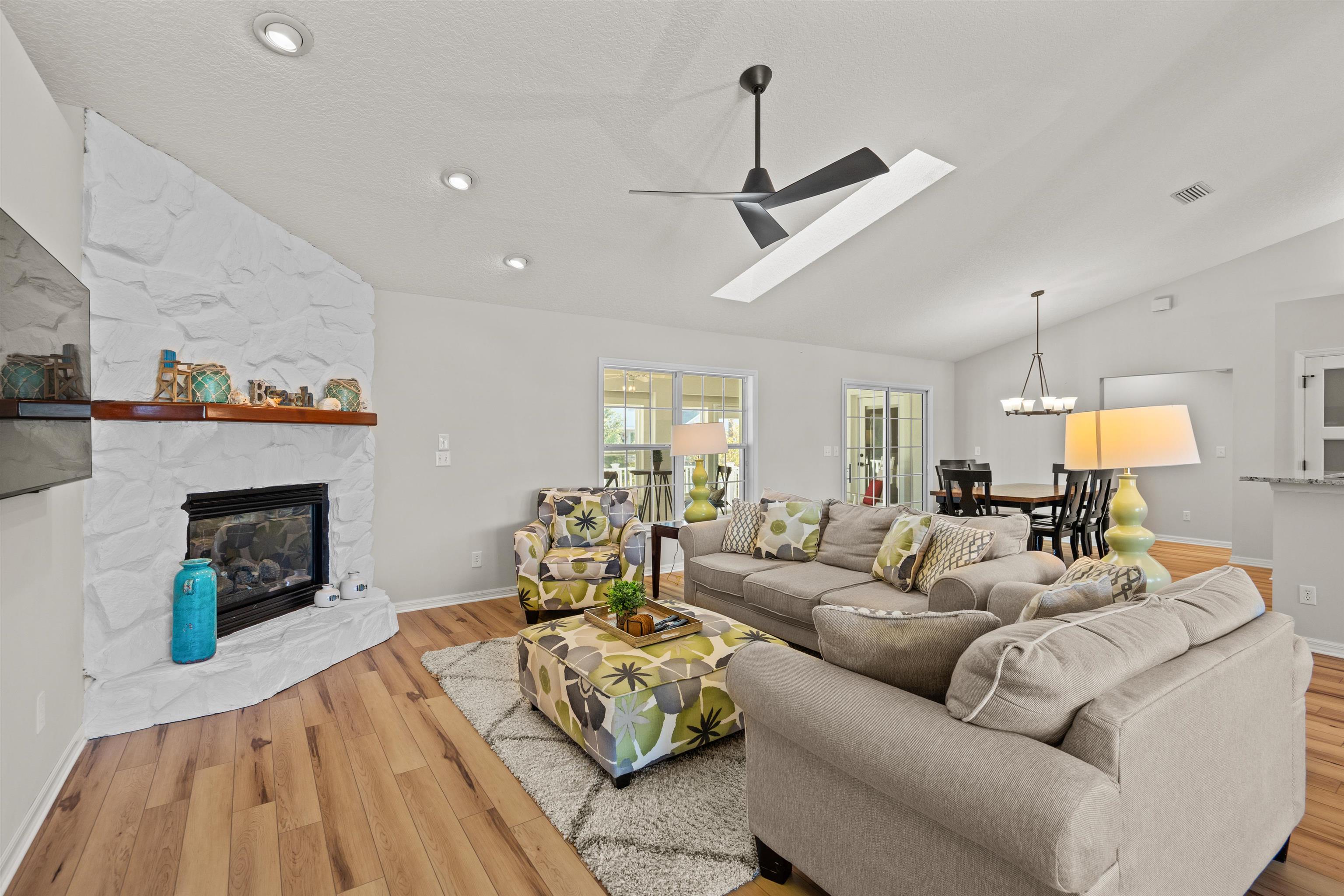 21 Ocean Trace Road St. Augustine, FL 32080 - Photo 23 of 48 a living room with furniture and a fireplace