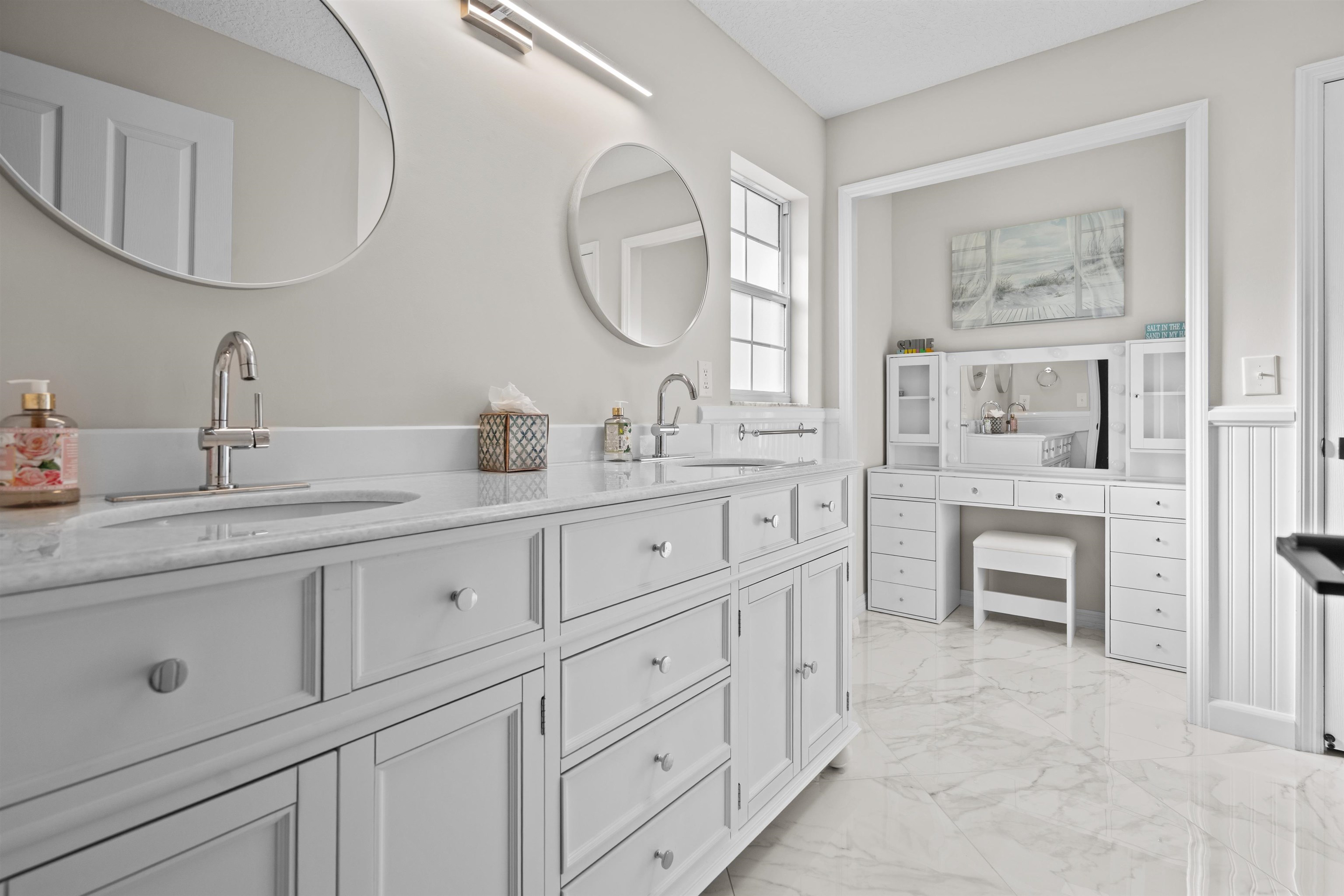 21 Ocean Trace Road St. Augustine, FL 32080 - Photo 30 of 48 a bathroom with a double vanity sink mirror and