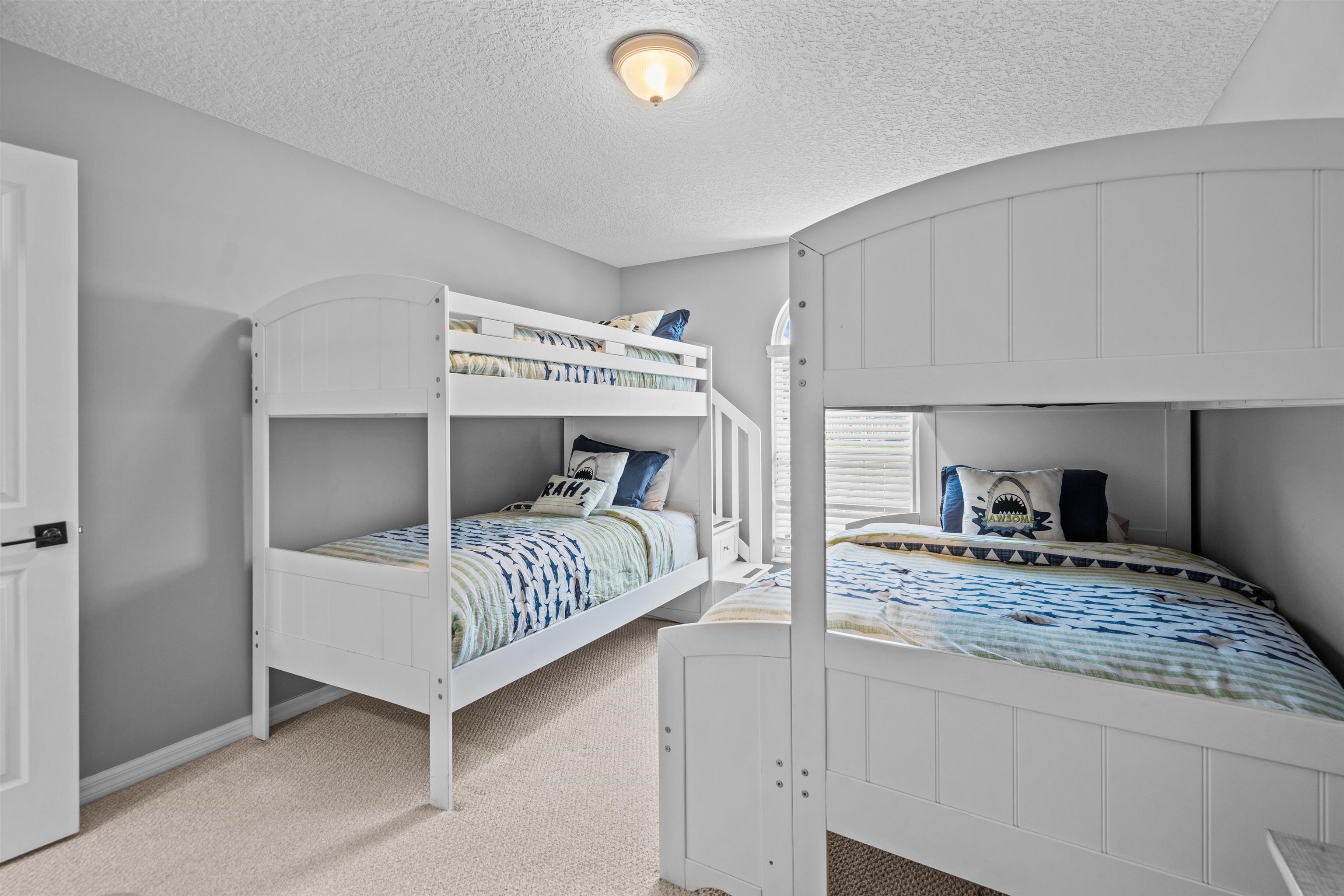 21 Ocean Trace Road St. Augustine, FL 32080 - Photo 35 of 48 a bedroom with a bed and a view of living room