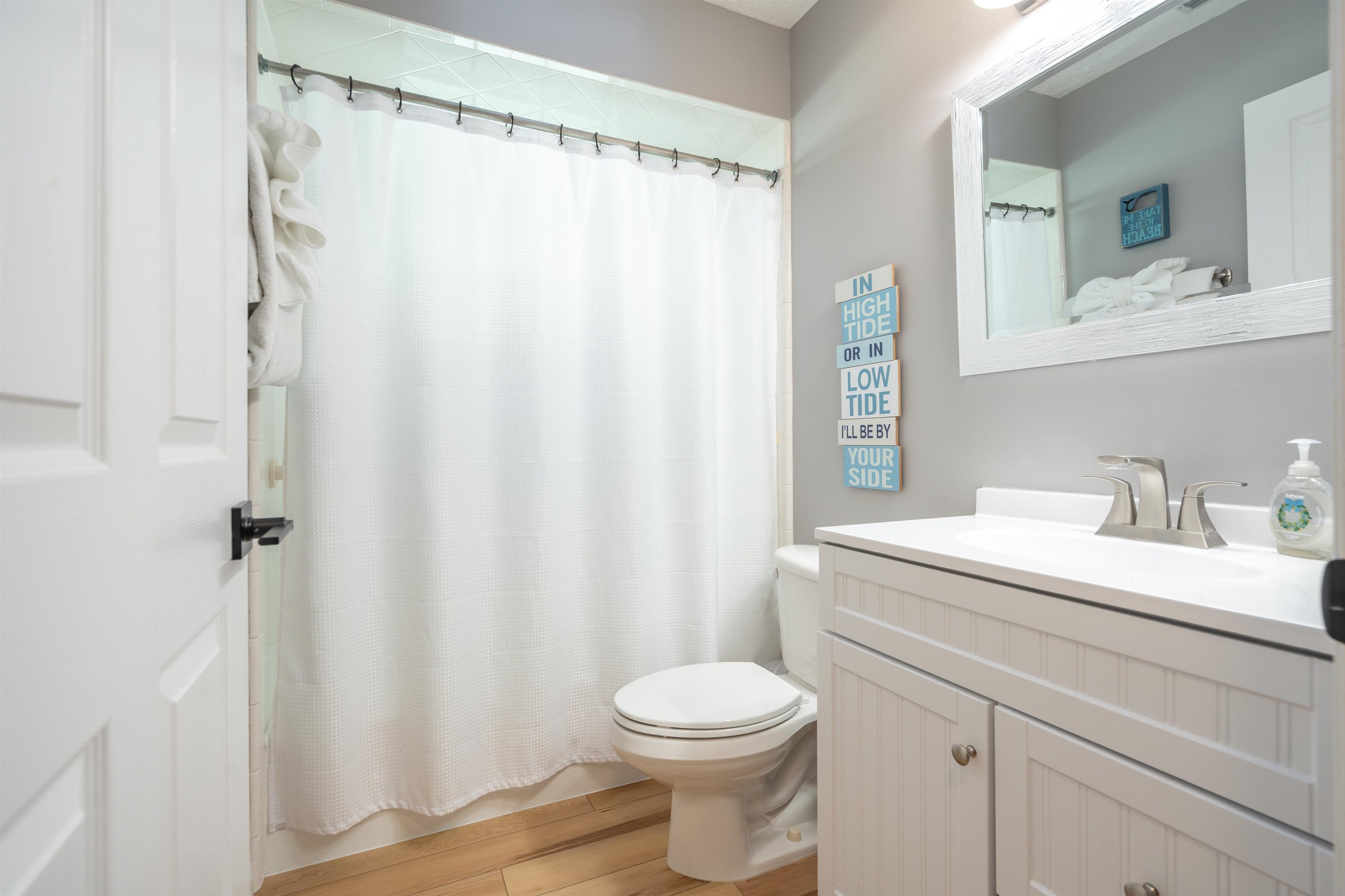 21 Ocean Trace Road St. Augustine, FL 32080 - Photo 36 of 48 a bathroom with a sink a toilet and a mirror