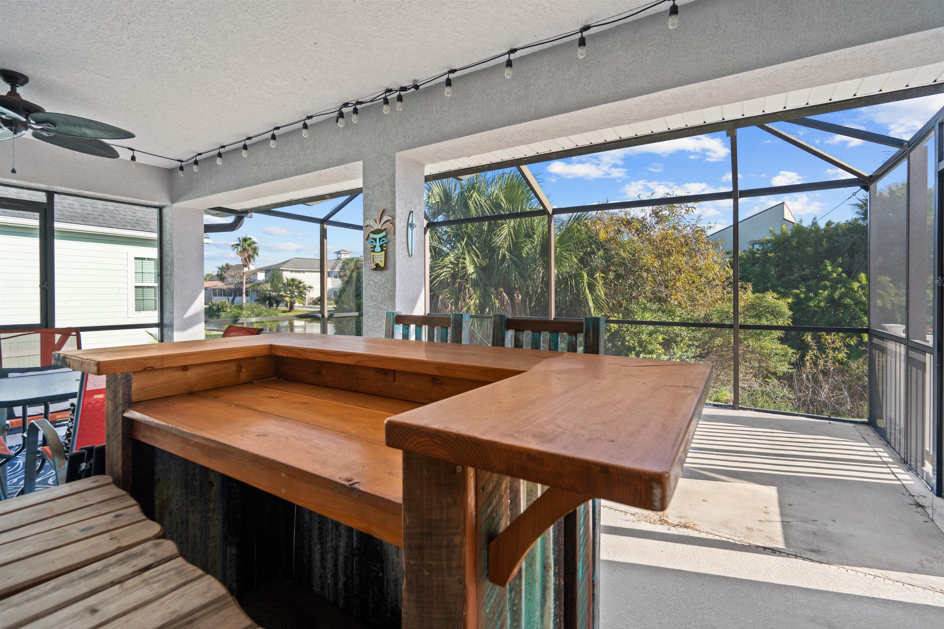 21 Ocean Trace Road St. Augustine, FL 32080 - Photo 40 of 48 a view of a patio with a table and chairs