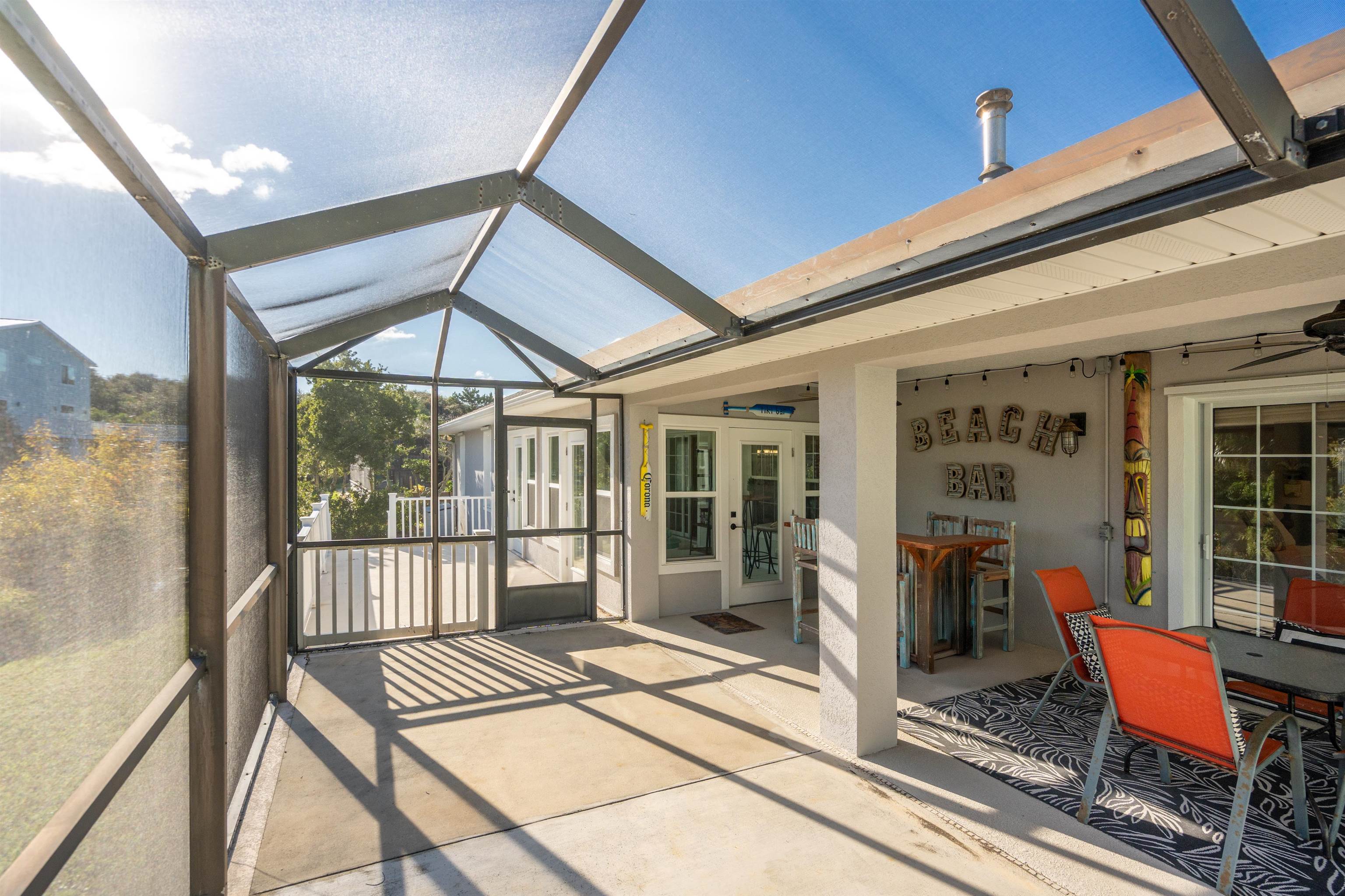 21 Ocean Trace Road St. Augustine, FL 32080 - Photo 43 of 48 a bedroom with furniture wooden floor and a rug