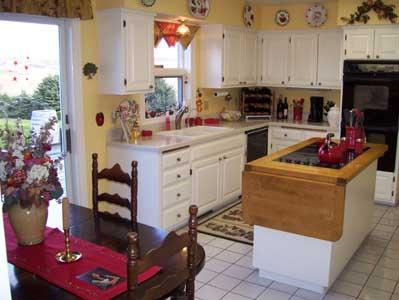 2341 Rosenkranz Road Tieton, WA 98947 - Photo 2 of 23 a kitchen with stainless steel appliances kitchen island granite countertop a stove a sink and a refrigerator