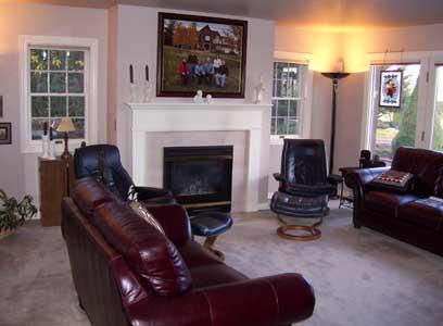 2341 Rosenkranz Road Tieton, WA 98947 - Photo 6 of 23 a living room with furniture a flat screen tv and a fireplace
