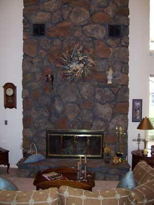2341 Rosenkranz Road Tieton, WA 98947 - Photo 9 of 23 a living room with furniture and a fireplace