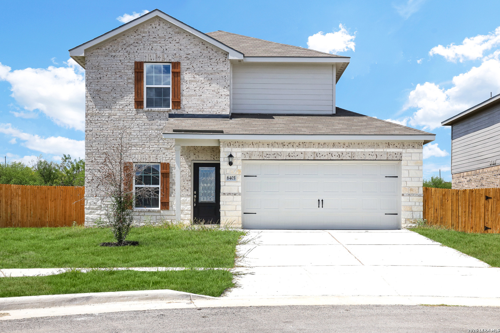 front view of a house with a garden