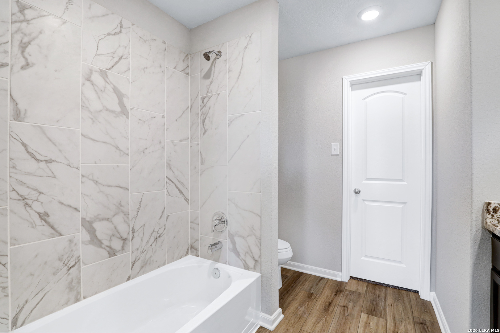 6403 Warhol Cape Converse, TX 78109 - Photo 20 of 29 a bathroom with a bathtub and a shower