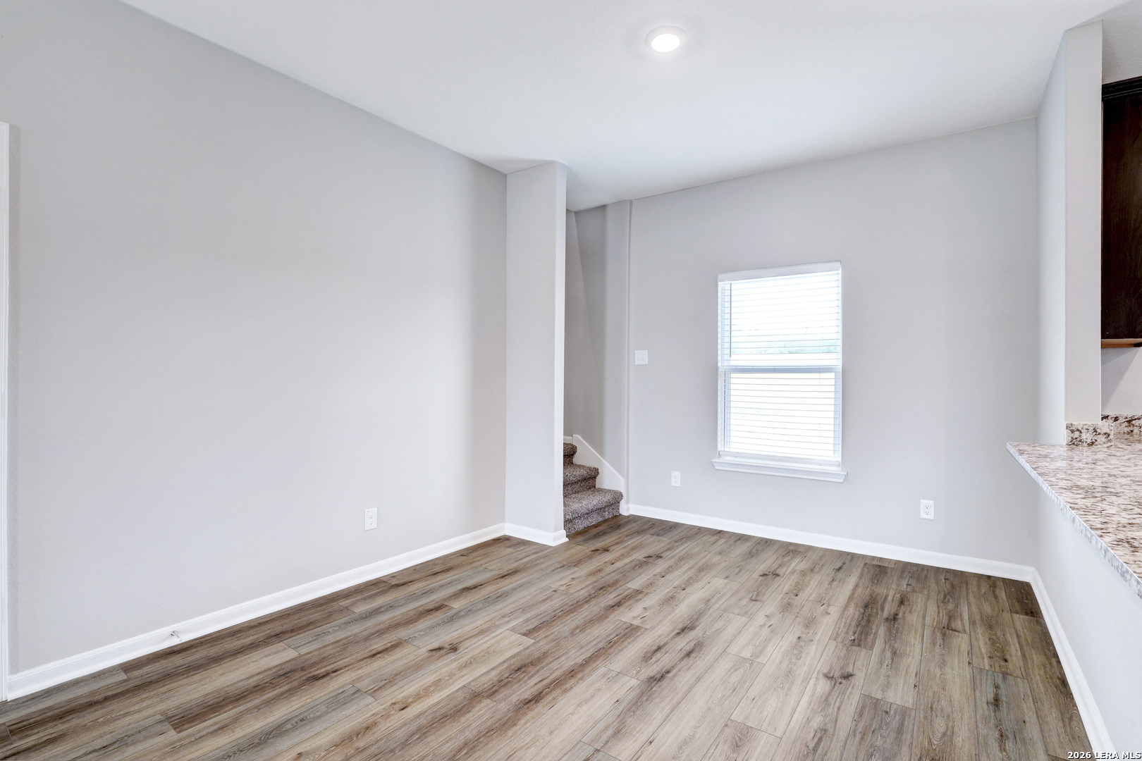 6403 Warhol Cape Converse, TX 78109 - Photo 8 of 29 an empty room with wooden floor and windows