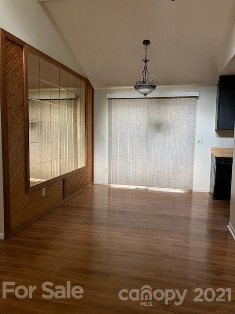 6605 Piney Path Road Charlotte, NC 28212 - Photo 3 of 21 a view of an empty room with wooden floor and a window