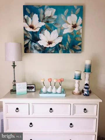 a view of white cabinets and with wooden floor
