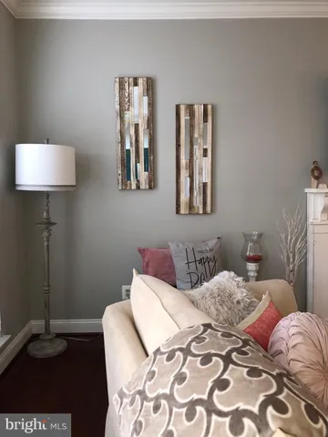 a bedroom with a bed and a lamp