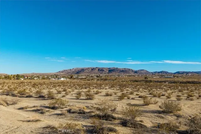 an aerial view of residential building and ocean
