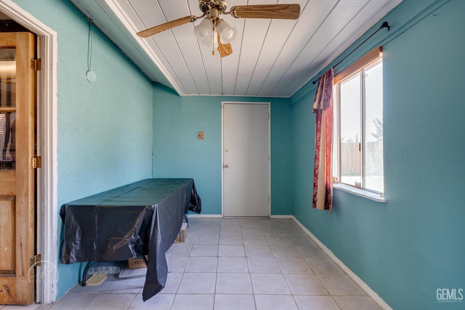 Undisclosed Address Bakersfield, CA 93307 - Photo 14 of 19 a view of entryway with workspace and window