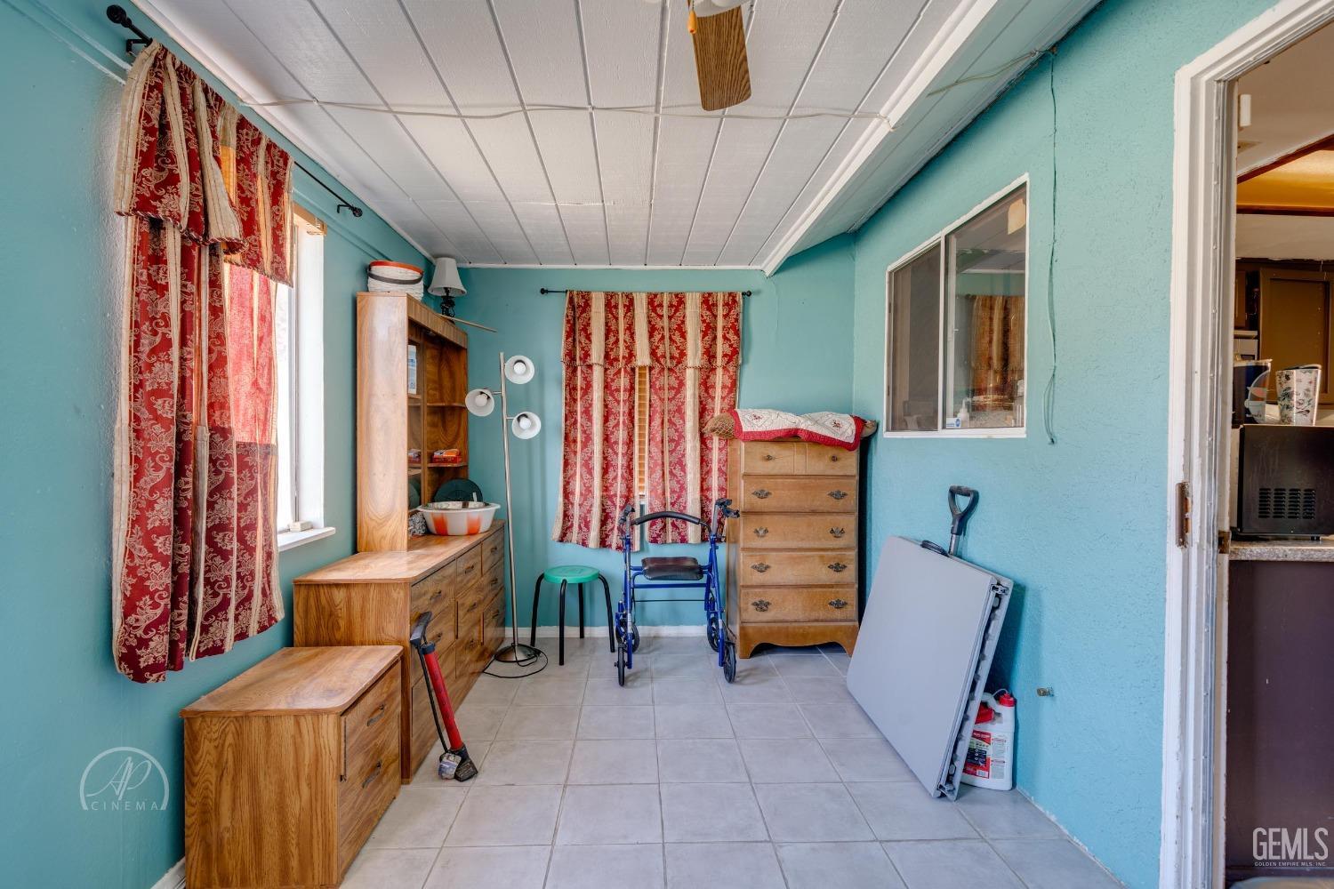 Undisclosed Address Bakersfield, CA 93307 - Photo 15 of 19 a room with furniture and a window