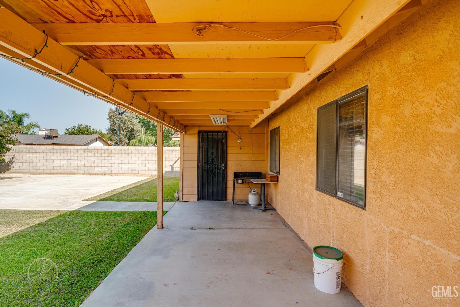 Undisclosed Address Bakersfield, CA 93307 - Photo 16 of 19 a view of a porch with furniture and a yard