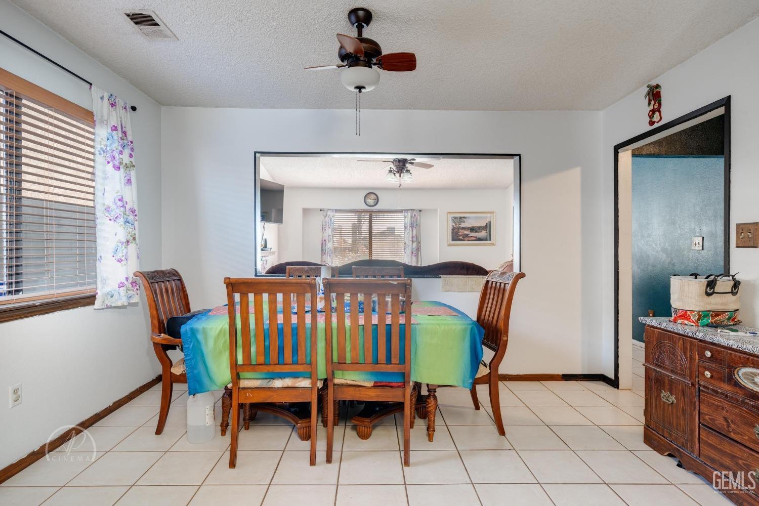 Undisclosed Address Bakersfield, CA 93307 - Photo 7 of 19 a dining room with furniture and window