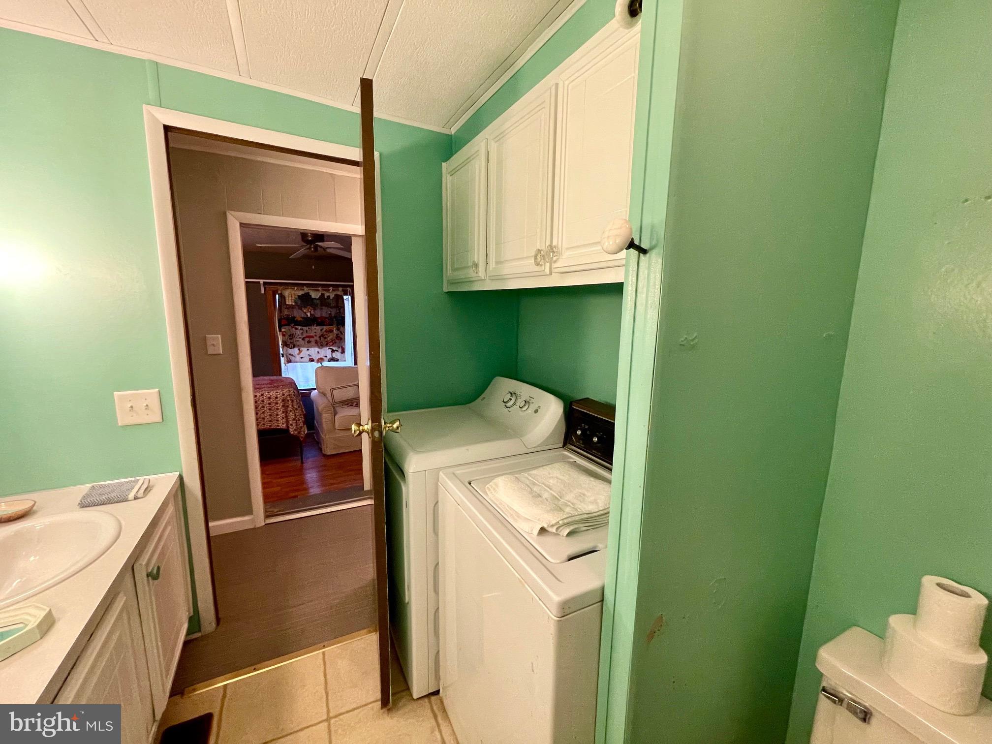 31627 Reading Street Ocean View, DE 19970 - Photo 14 of 21 a utility room with dryer and washer