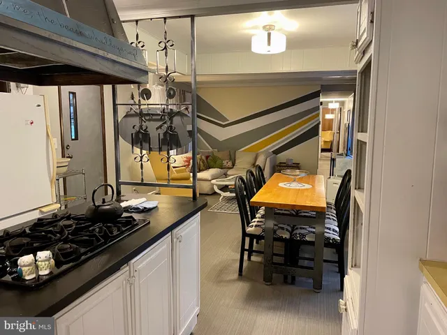 a kitchen with table and chairs