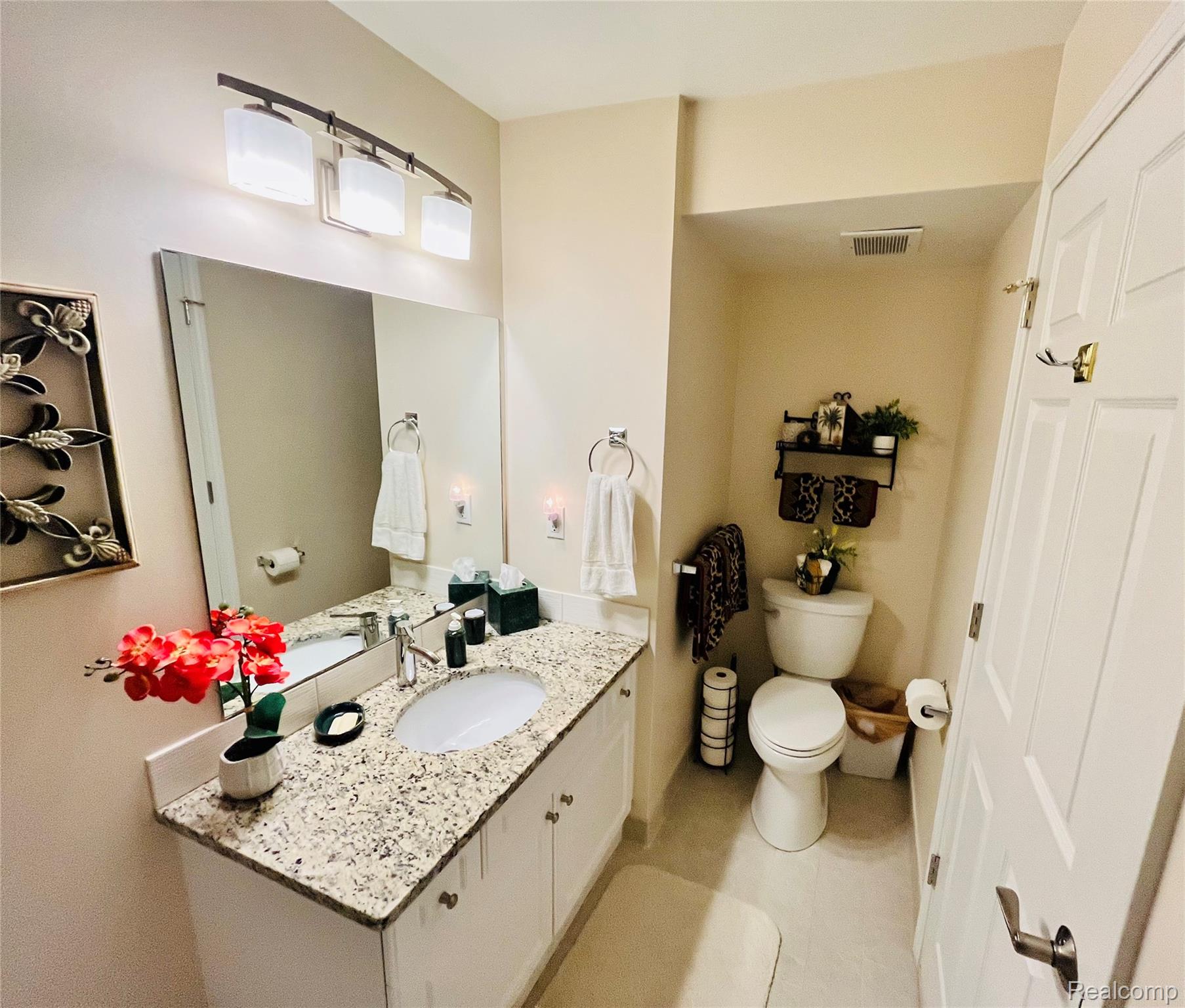3624 Oakmonte Boulevard, Unit 82 Rochester, MI 48306 - Photo 23 of 37 Half bathroom featuring vanity and light tile patterned flooring