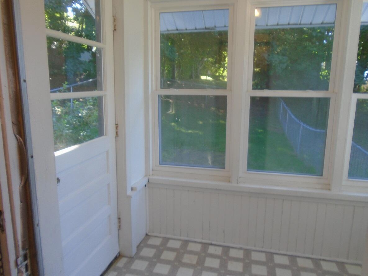 23 Fowler Street Augusta, ME 04330 - Photo 8 of 25 8 Rear encl porch and fenced yard entry