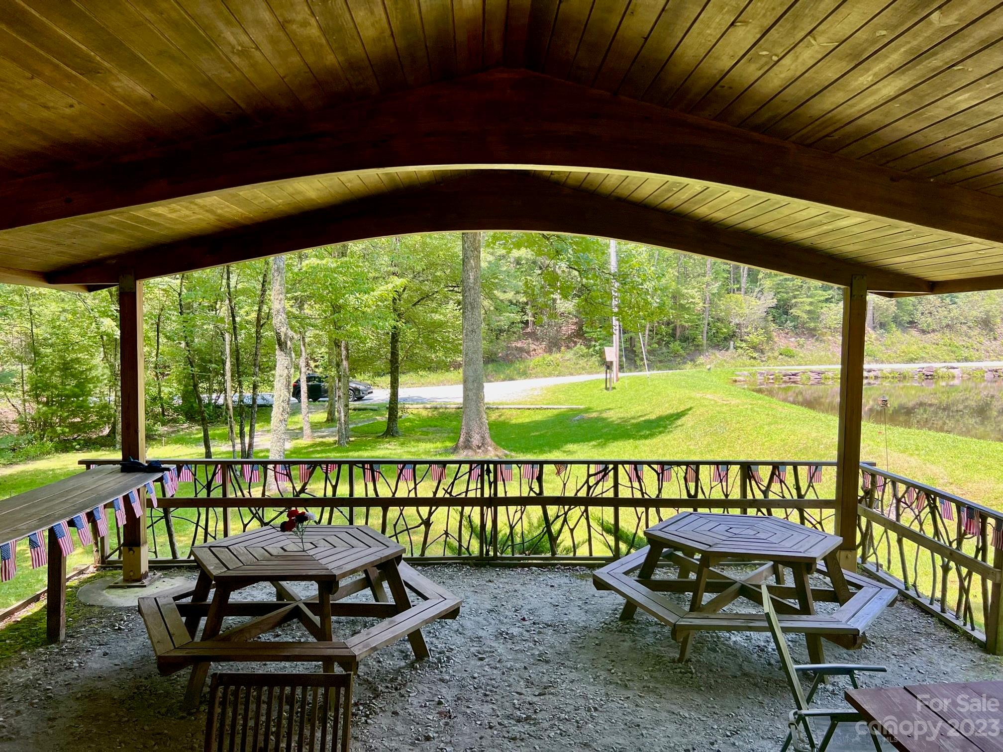 Lot 24 Round Mountain Road, Unit 24 Brevard, NC 28712 - Photo 19 of 22 a view of chairs and table in the patio