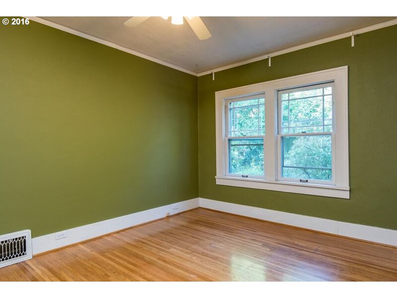 6026 Southwest Vermont Street Portland, OR 97219 - Photo 16 of 24 a view of an empty room with wooden floor and a window