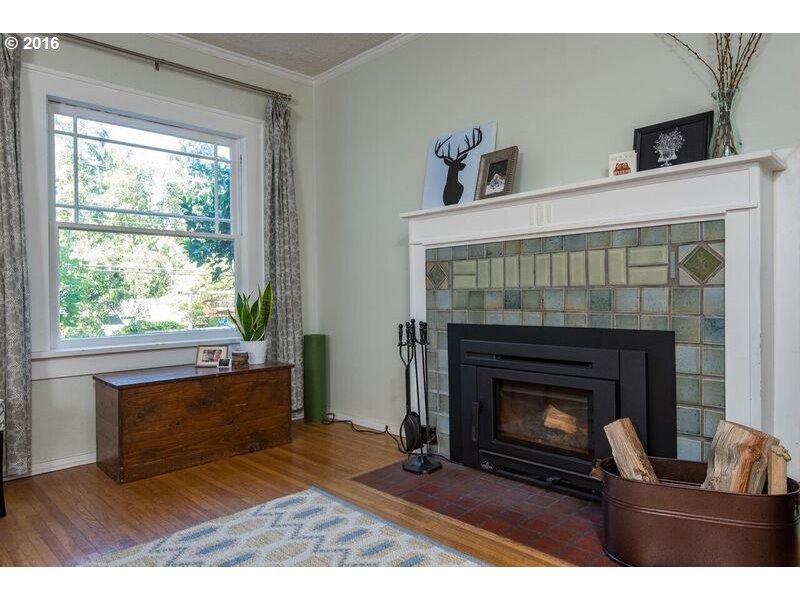 6026 Southwest Vermont Street Portland, OR 97219 - Photo 5 of 24 a living room with furniture and a fireplace