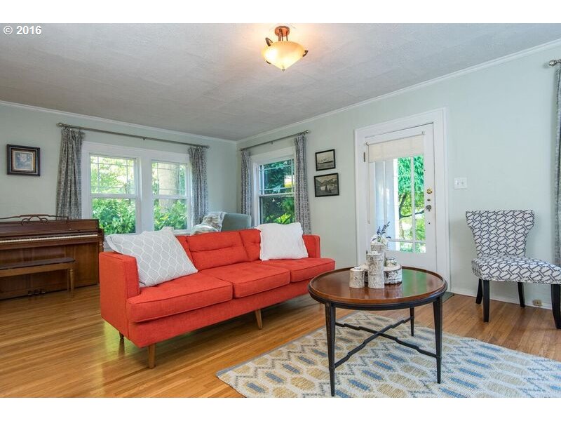 6026 Southwest Vermont Street Portland, OR 97219 - Photo 6 of 24 a living room with furniture and a wooden floor