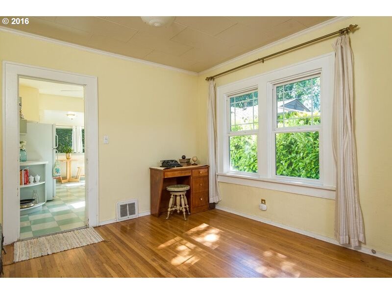 6026 Southwest Vermont Street Portland, OR 97219 - Photo 7 of 24 a view of empty room with wooden floor and a window