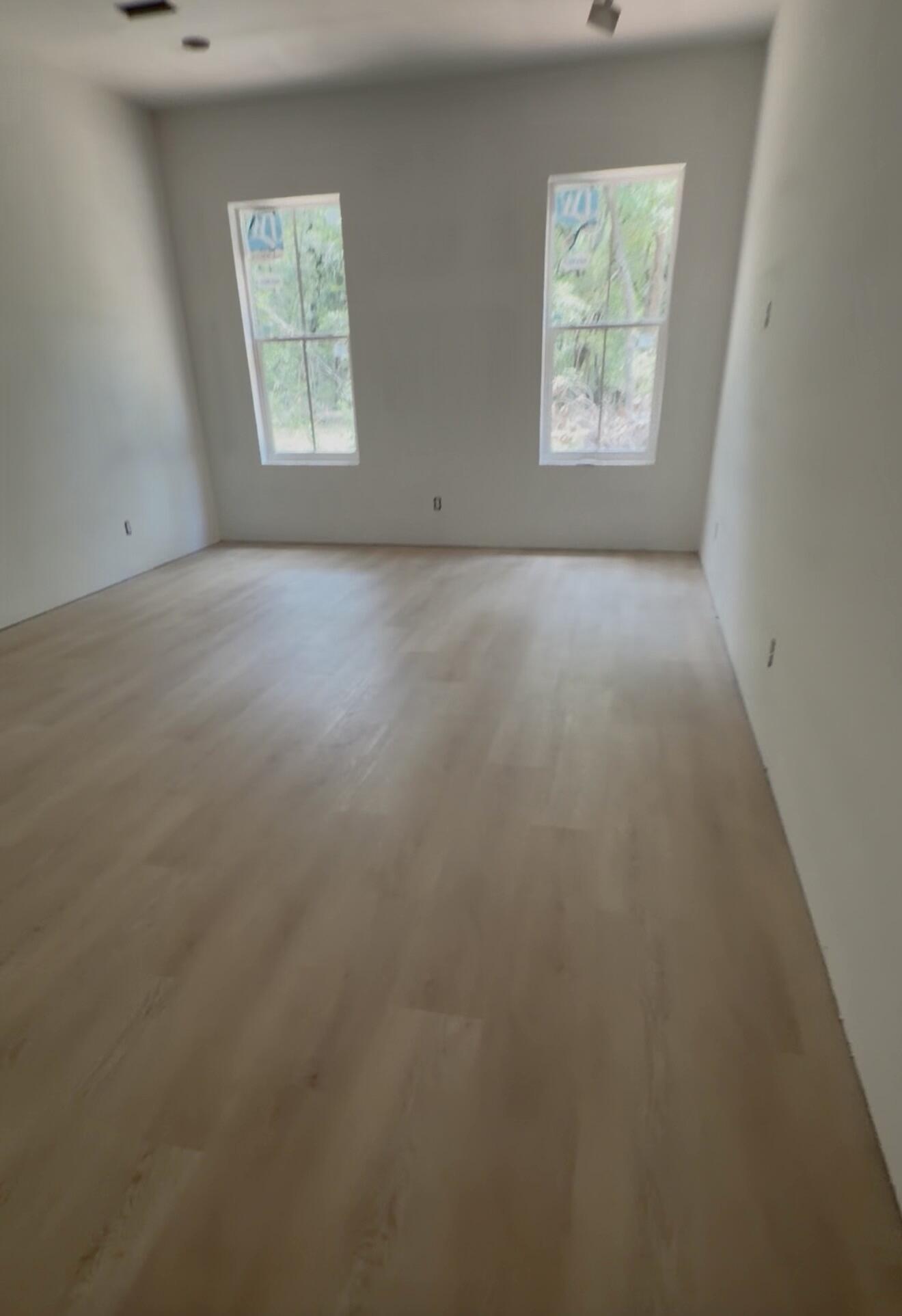 219 South J Hunter's Way, Unit LOT 73 Freeport, FL 32439 - Photo 5 of 10 an empty room with windows