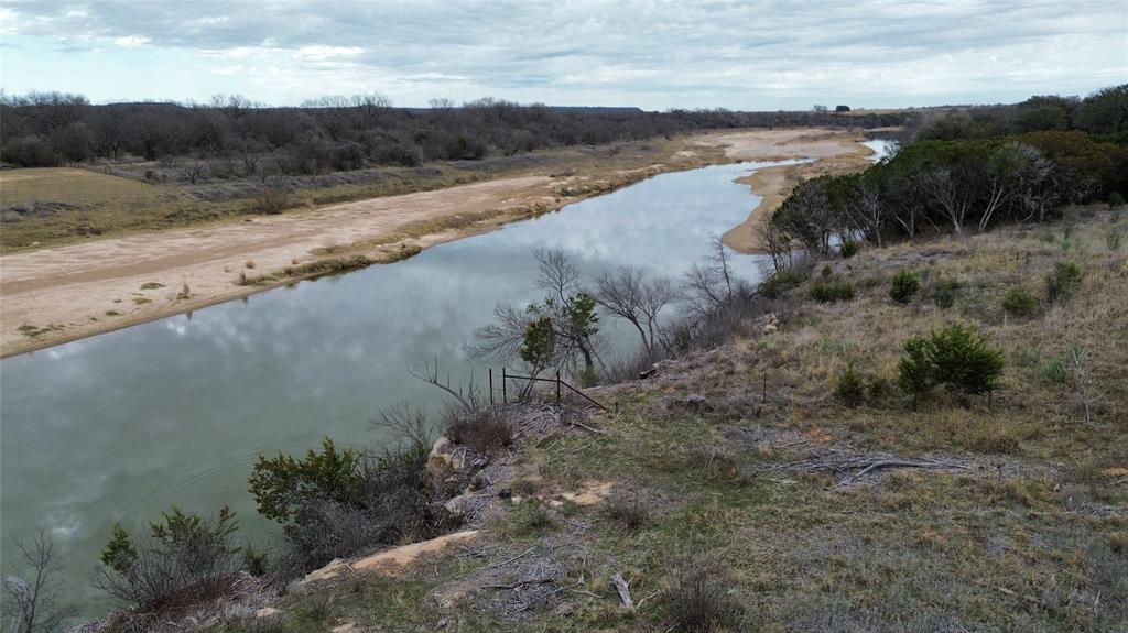 Lot 136 River Canyon Road Palo Pinto, TX 76484 - Photo 15 of 26 a view of a lake with beach and green space