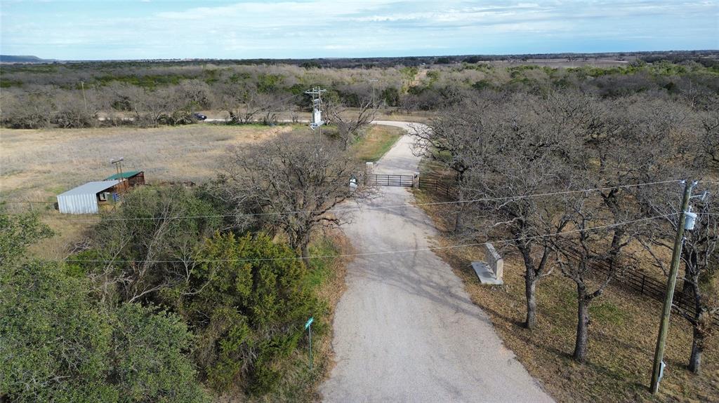 Lot 136 River Canyon Road Palo Pinto, TX 76484 - Photo 3 of 26 a view of a dry yard with wooden floor and lake view