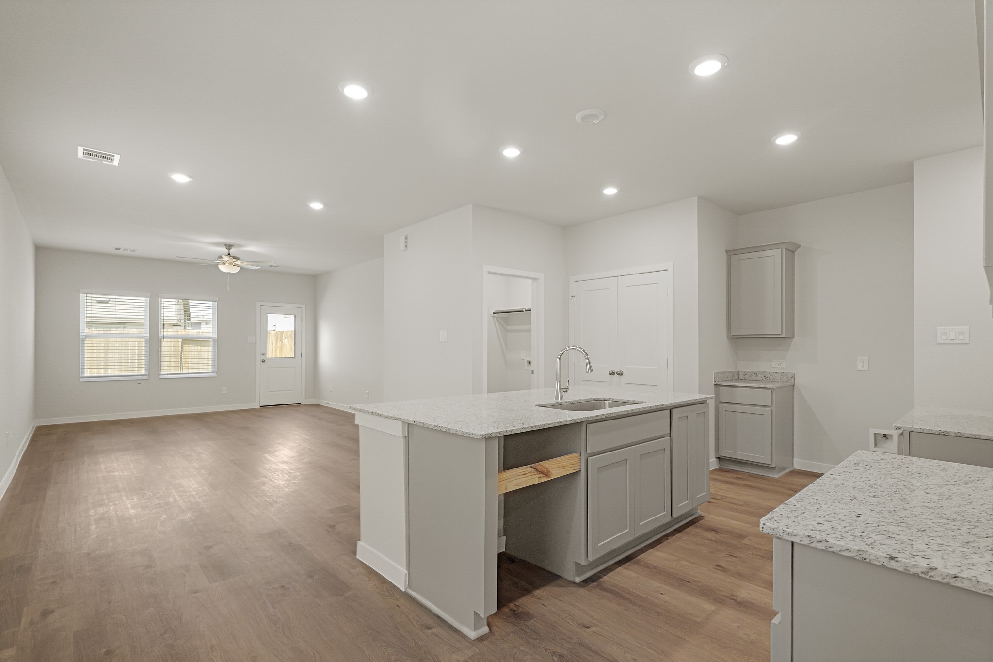 225 Spring Drive Hockley, TX 77447 - Photo 15 of 28 a kitchen with a sink stove and cabinets