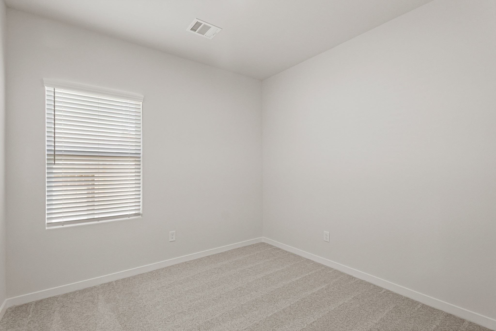 225 Spring Drive Hockley, TX 77447 - Photo 7 of 28 an empty room with a window