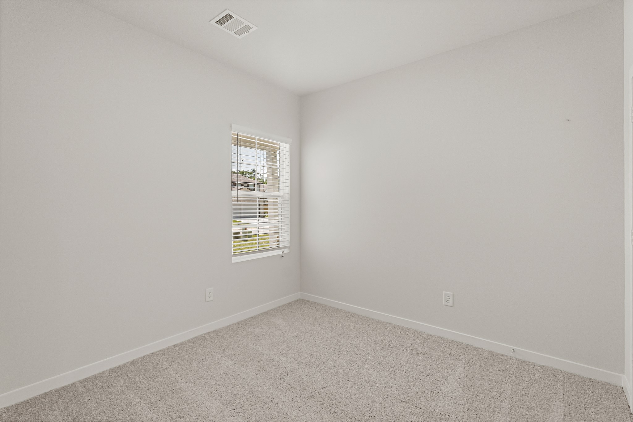 225 Spring Drive Hockley, TX 77447 - Photo 9 of 28 a view of an empty room with a window