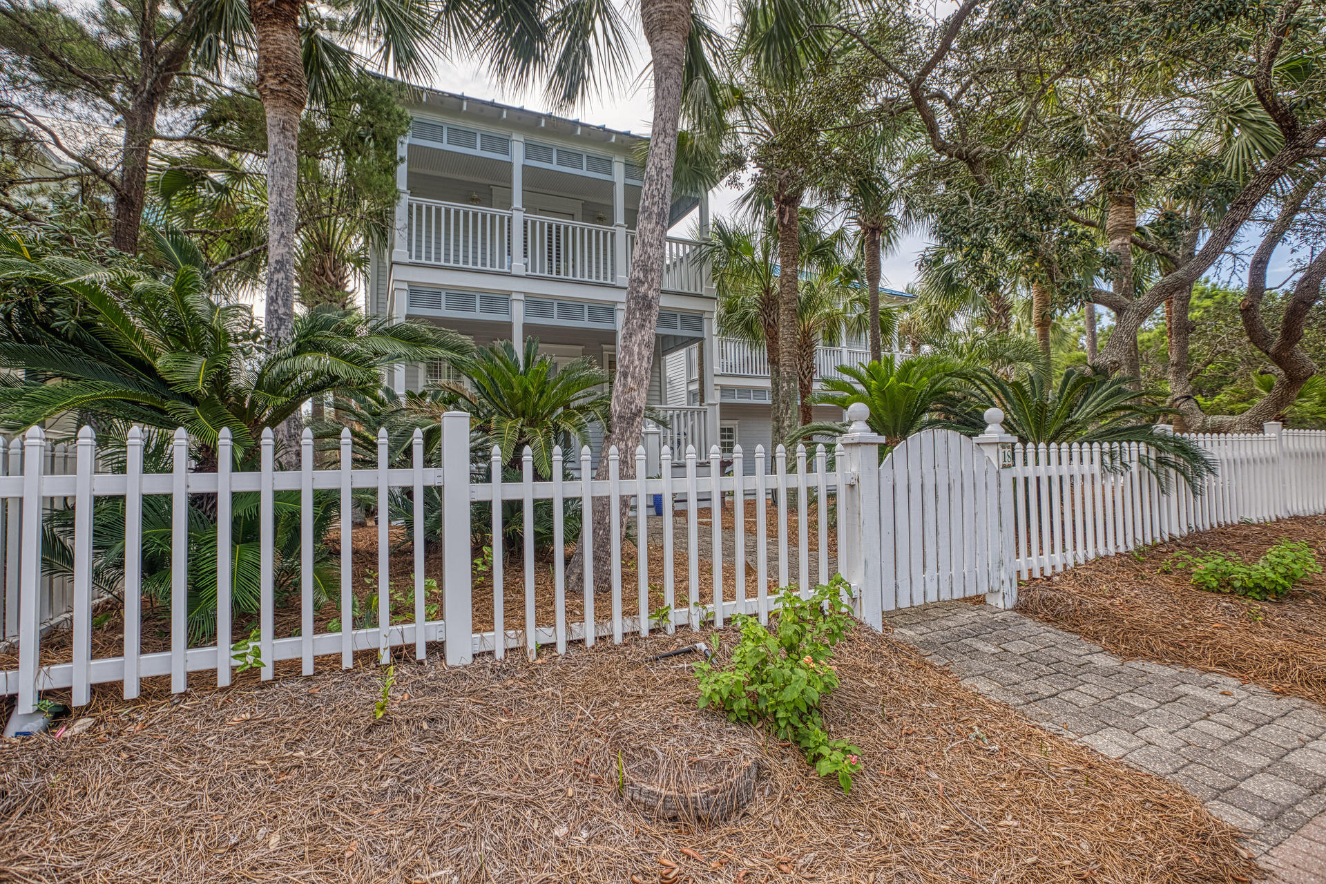 18 Draper Lane Santa Rosa Beach, FL 32459 - Photo 3 of 63 a front view of a house with a garden
