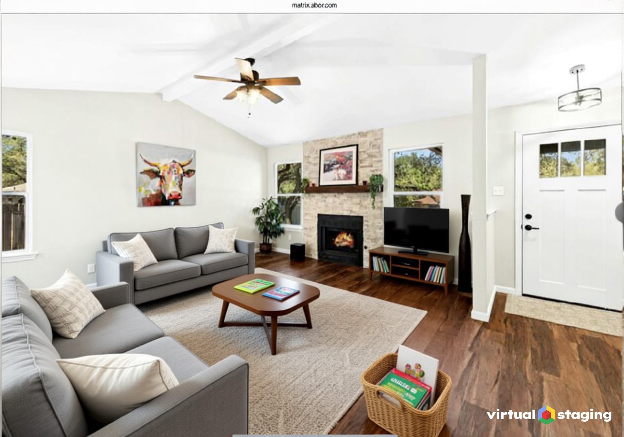 Living area with LVP wood-type flooring, a stacked stone gas fireplace with new light fixture & ceiling fan & new energy efficient windows.