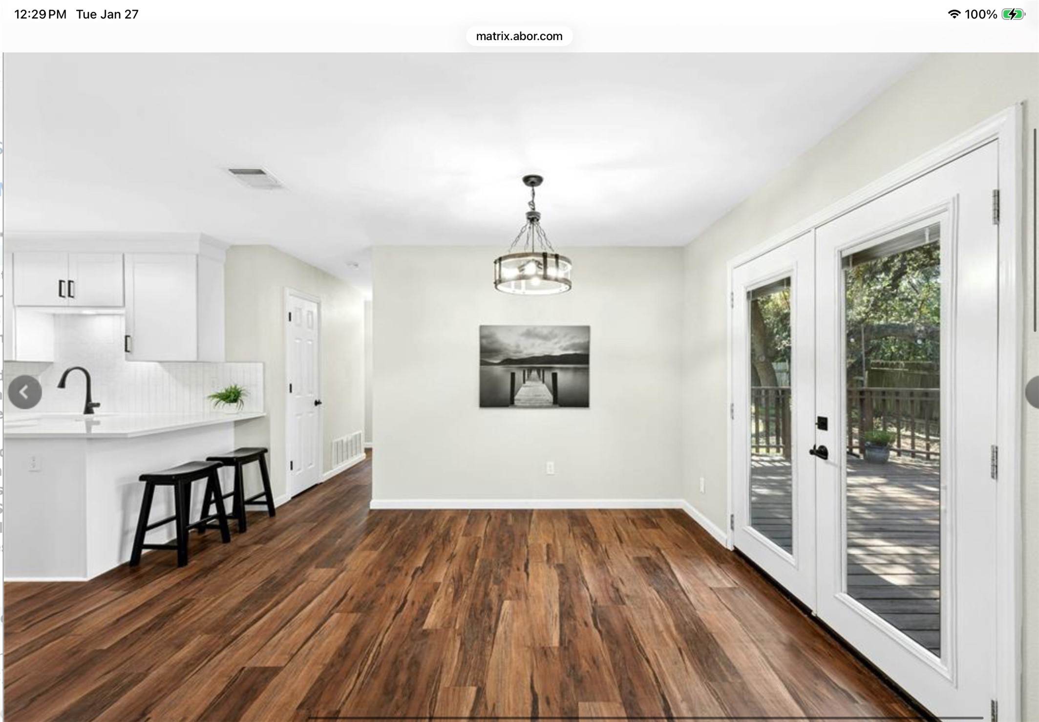 12904 Garfield Lane Austin, TX 78727 - Photo 13 of 31 Unfurnished dining area with dark wood-style flooring and a chandelier