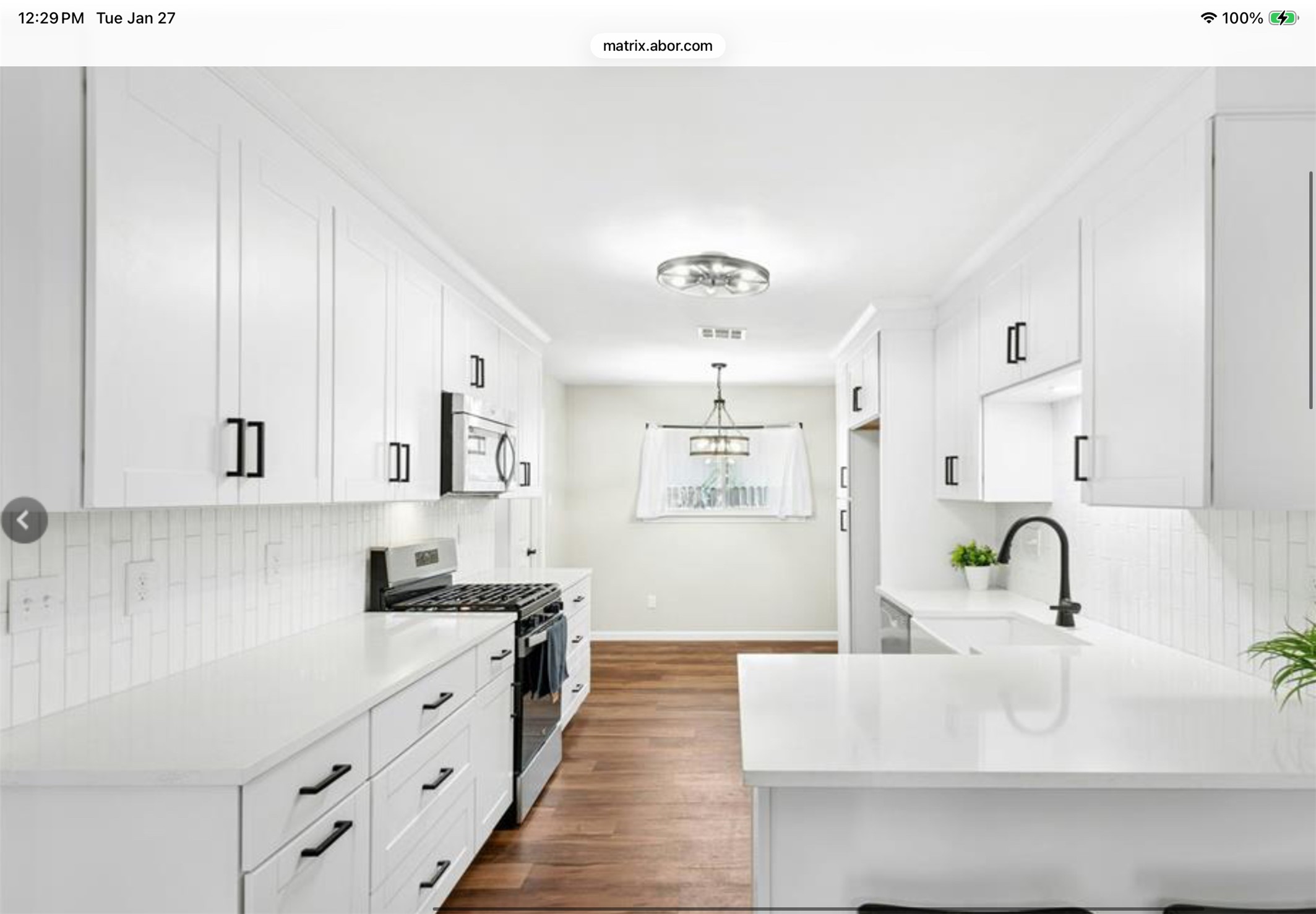 12904 Garfield Lane Austin, TX 78727 - Photo 2 of 31 Kitchen with all new stainless steel appliances, new 42” white cabinets, new backsplash, new faucet, new granite countertops and a breakfast bar for quick bites.