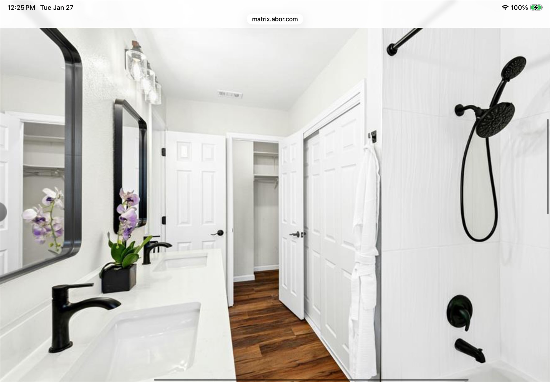 12904 Garfield Lane Austin, TX 78727 - Photo 21 of 31 Full bath featuring double vanity, washtub / shower combination, and dark wood-type flooring