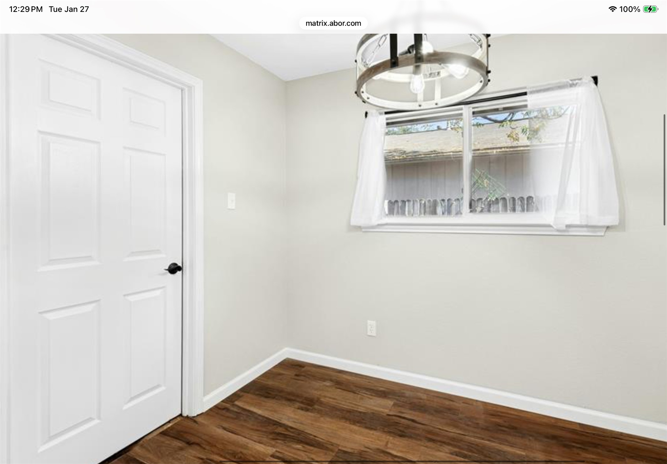 12904 Garfield Lane Austin, TX 78727 - Photo 25 of 31 Unfurnished breakfast area that leads to the garage features a new window, LVP wood-style flooring, new baseboards and fresh paint throughout.