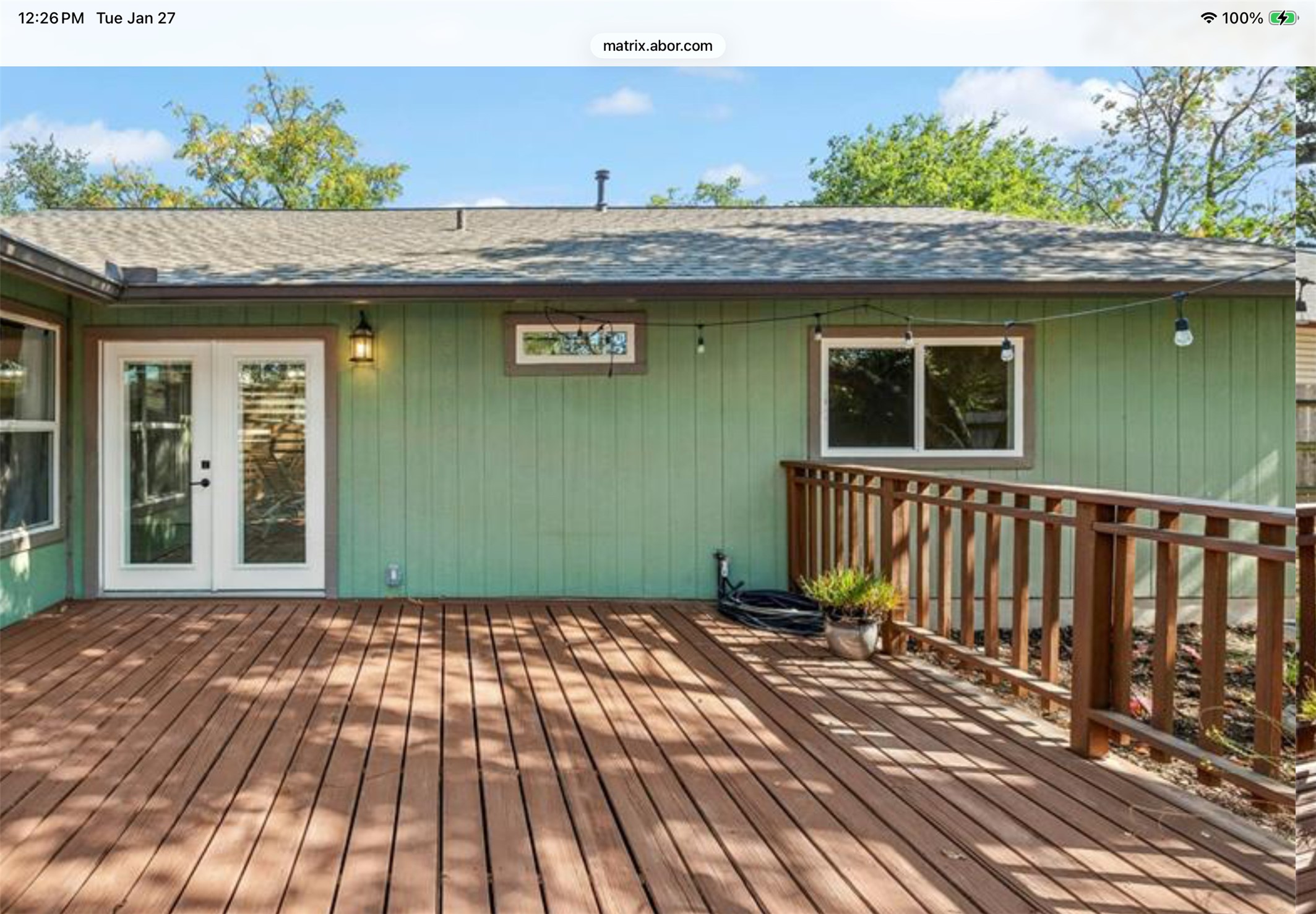 12904 Garfield Lane Austin, TX 78727 - Photo 27 of 31 Wooden deck featuring french doors that lead into the dining room.