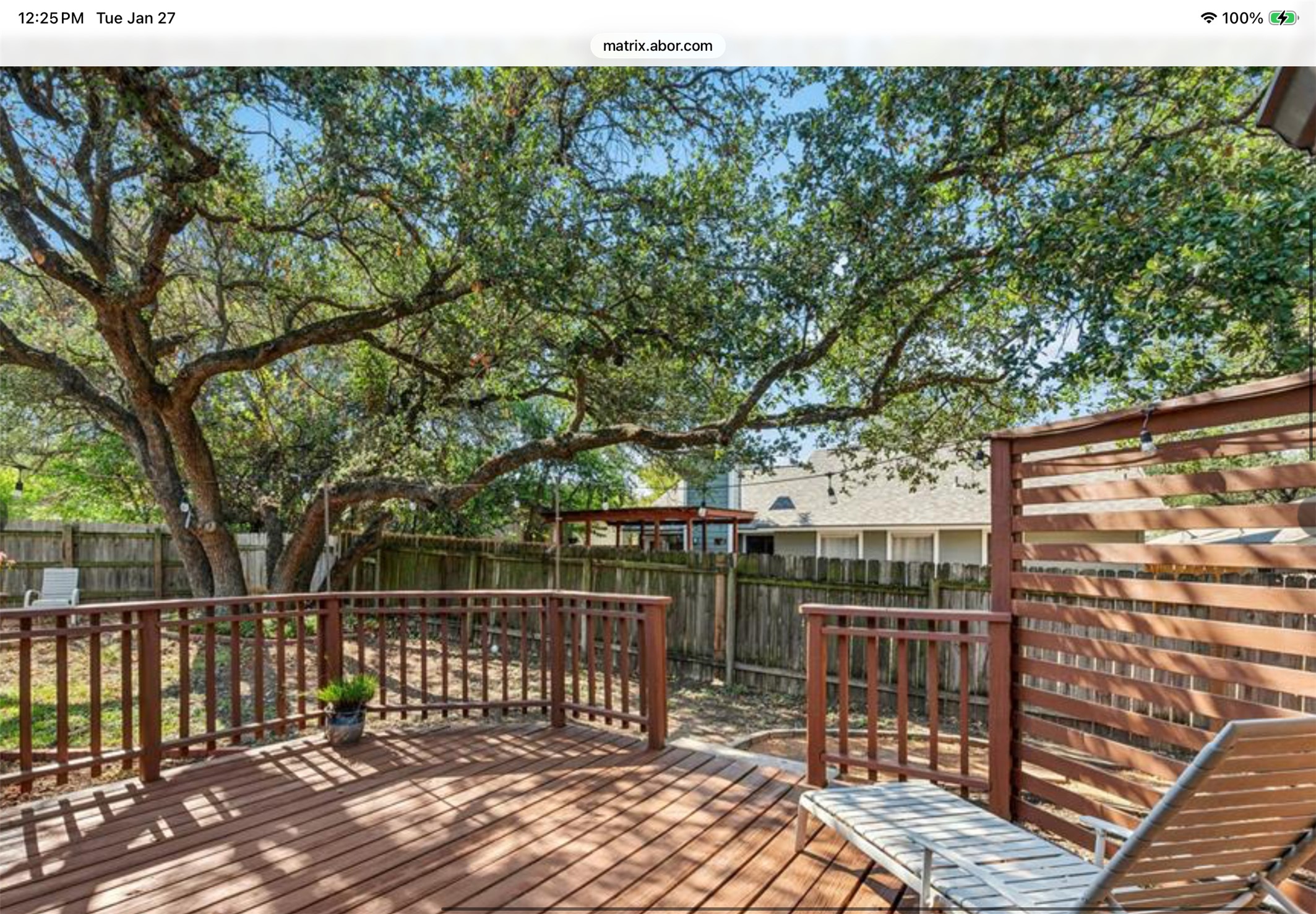 12904 Garfield Lane Austin, TX 78727 - Photo 28 of 31 Deck with a privacy screen and outdoor lighting brightens the space at night. Whether you are BBQing or hanging out with friends, there is space to relax and enjoy the cool evening breezes.