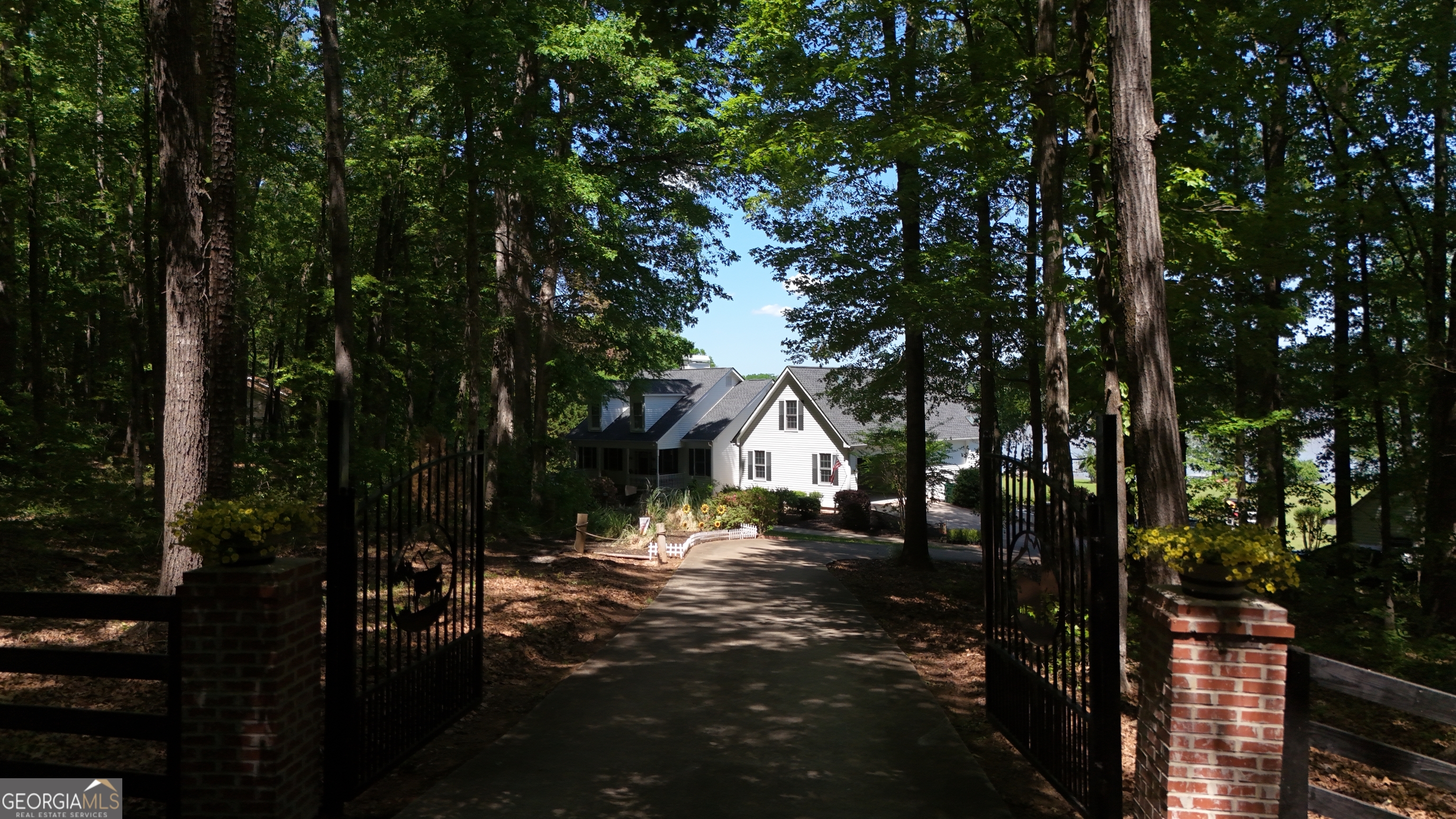 1051 Oconee Farms Road Greensboro, GA 30642 - Photo 17 of 23 a view of a house with a yard