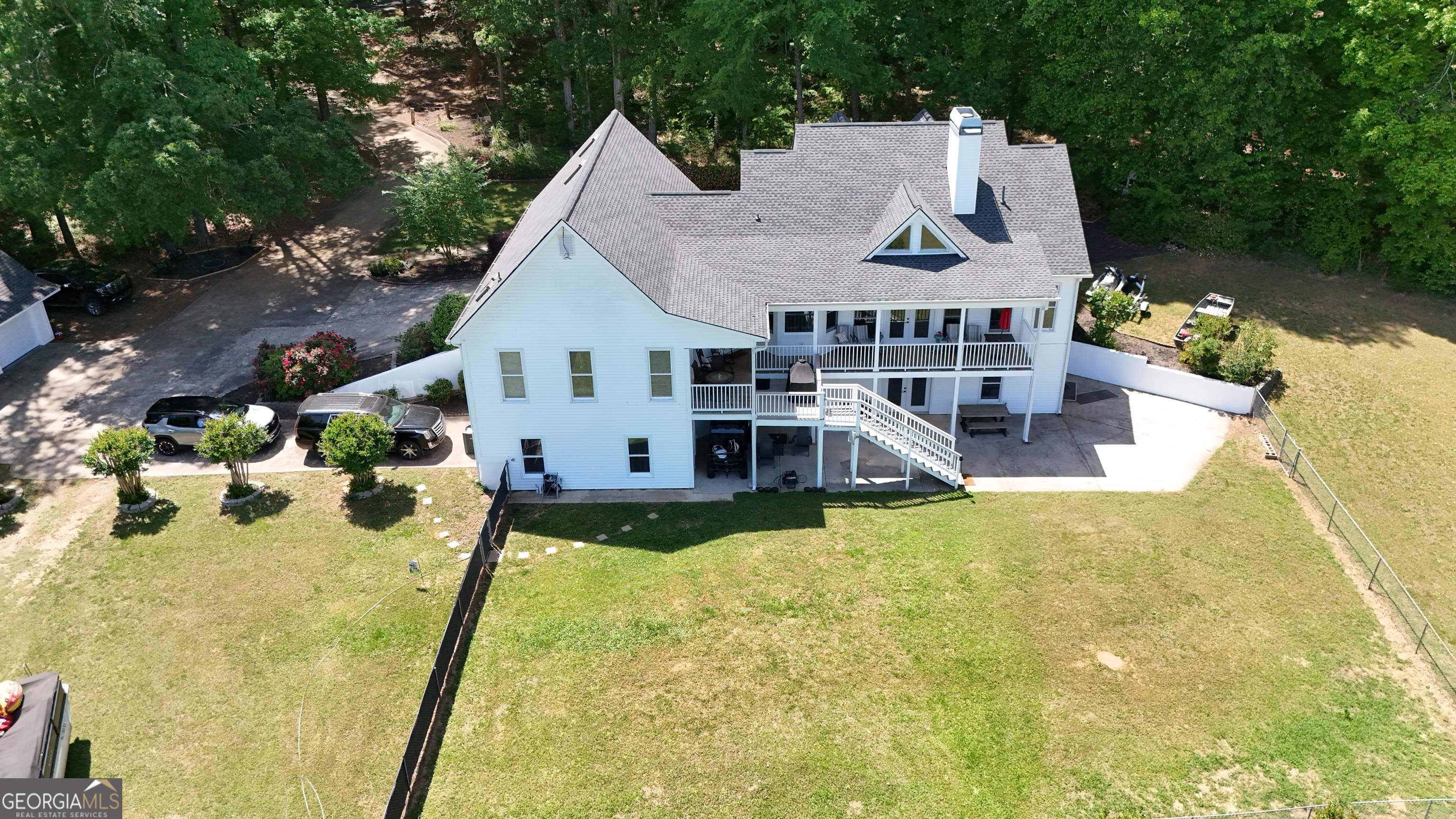 1051 Oconee Farms Road Greensboro, GA 30642 - Photo 22 of 23 a view of a house with swimming pool