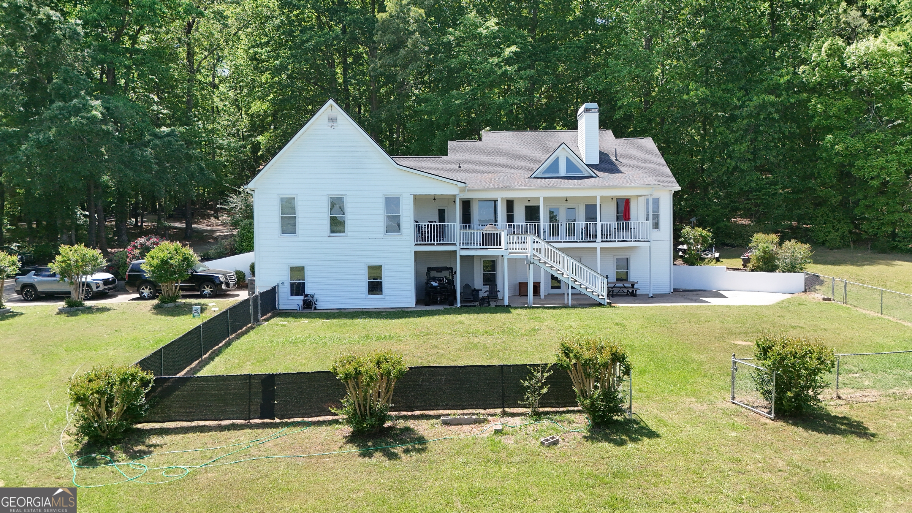 1051 Oconee Farms Road Greensboro, GA 30642 - Photo 23 of 23 a front view of a house with swimming pool