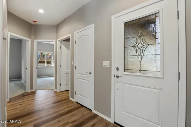 wooden floor with white walls