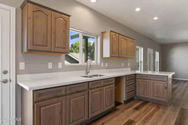 a kitchen with a sink and cabinets