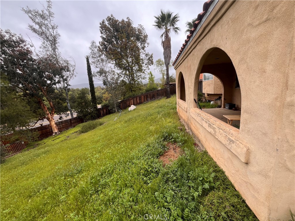 24638 Pappas Road Ramona, CA 92065 - Photo 19 of 23 a view of a yard with yellow lighting